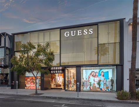 who owns guess store.